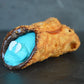 Heerlijk Cannoli Geboorte J/M gevuld met romige witte chocolade creme, versierd met blauwe voetjes.